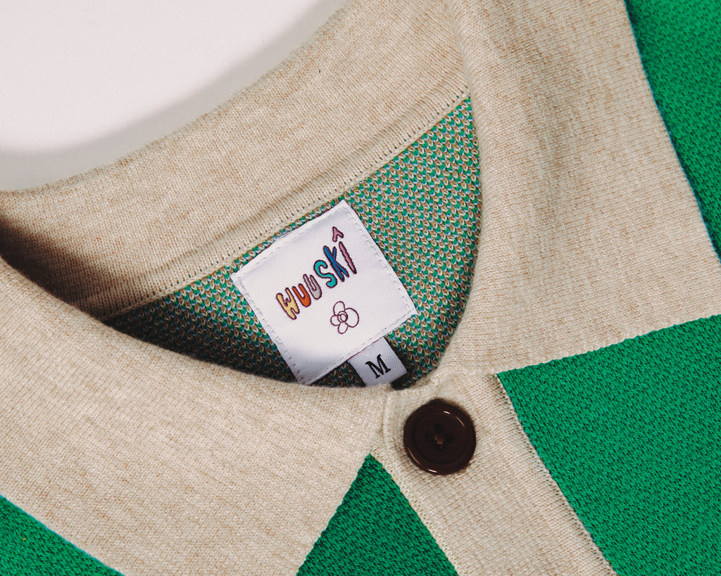 "Guns on Christmas" polo by WUUSKÎ — editorial lookbook shot, elevated streetwear