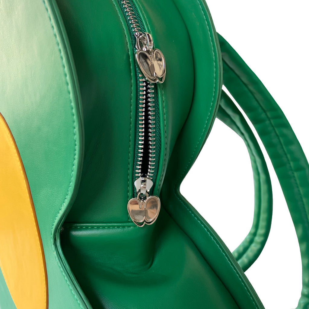 "Rewolf" green flower backpack by WUUSKÎ — back view, flower-shaped silhouette