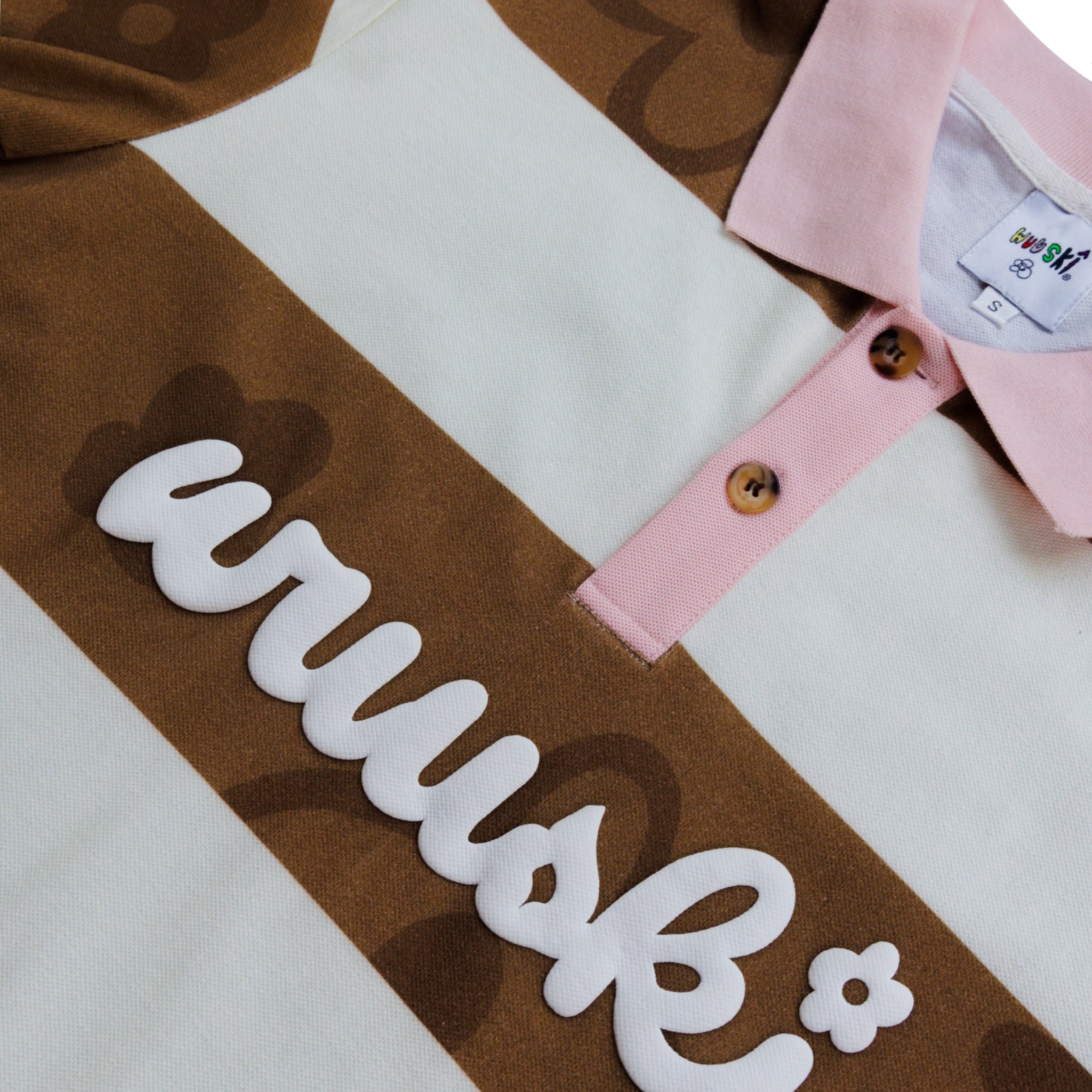 "Room 304" pique cotton polo by WUUSKÎ — lifestyle detail shot