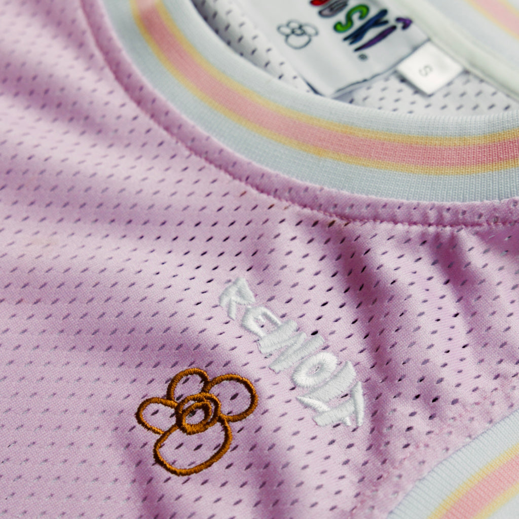 "Rewolf" pink home basketball jersey by WUUSKÎ — back view, styled shot