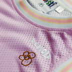 "Rewolf" pink home basketball jersey by WUUSKÎ — back view, styled shot
