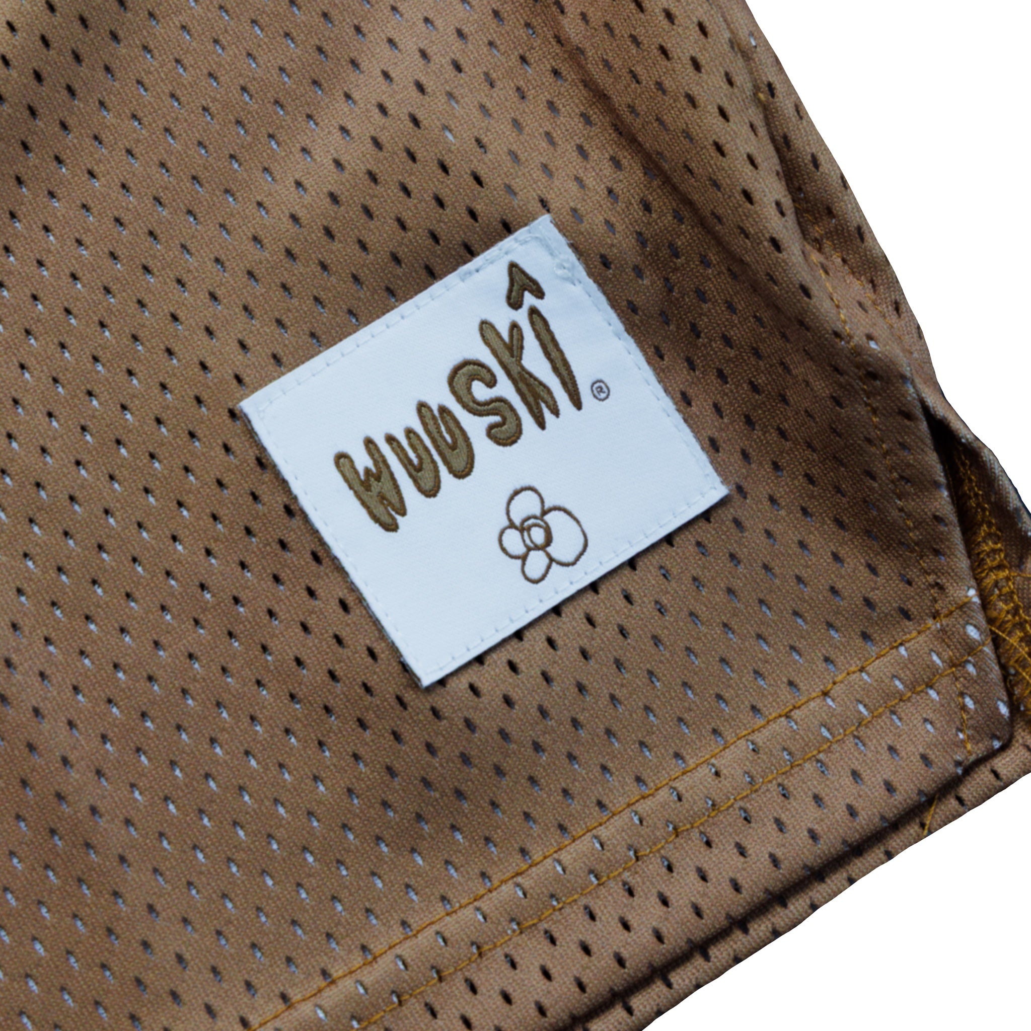 "Rewolf" brown/white away basketball jersey by WUUSKÎ — model wearing