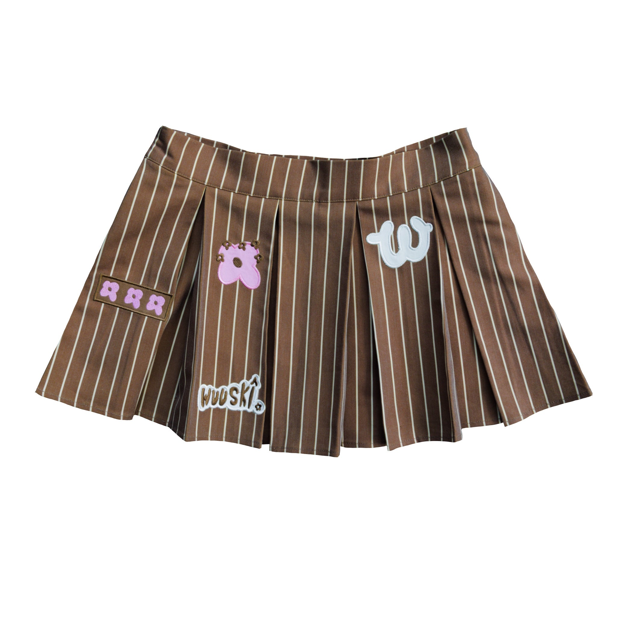 "Unîversity" pleated mini skort by WUUSKÎ — model wearing, polyester/rayon blend
