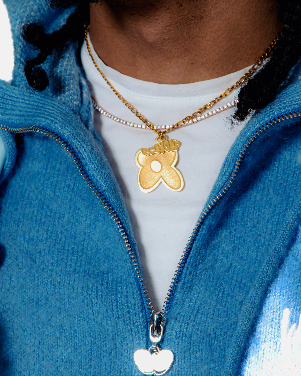 "Rewolf" gold necklace by WUUSKÎ — lifestyle shot, styled with WUUSKÎ pieces